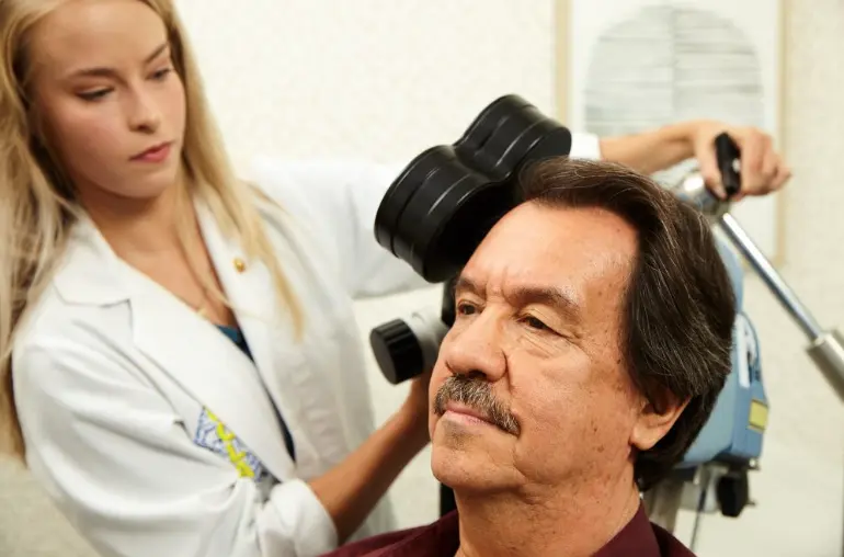 custom-tms-therapy-west-virginia older man receiving TMS treatment in West Virginia clinic